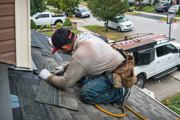 Professional Gutter Installation technician working in Rhodelia, KY